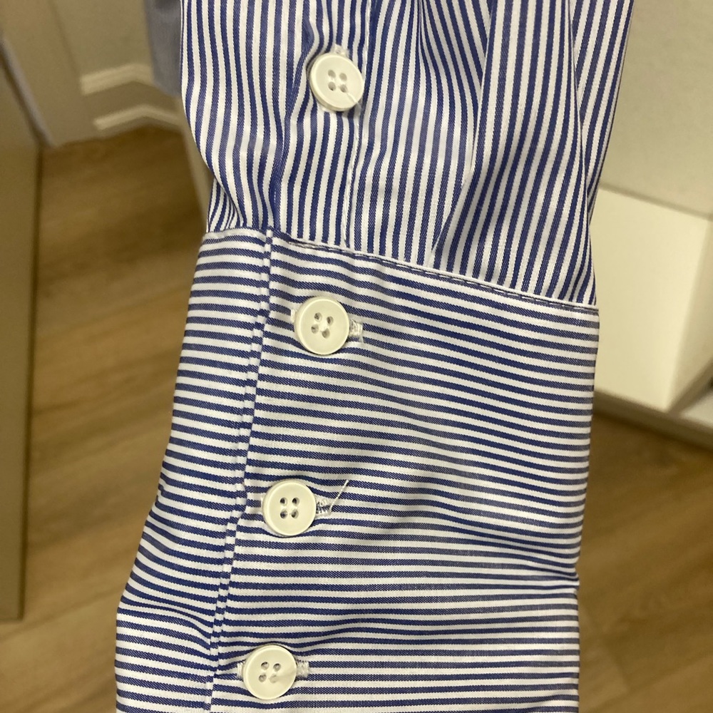 Beautiful blue and white Pomander Place blouse.